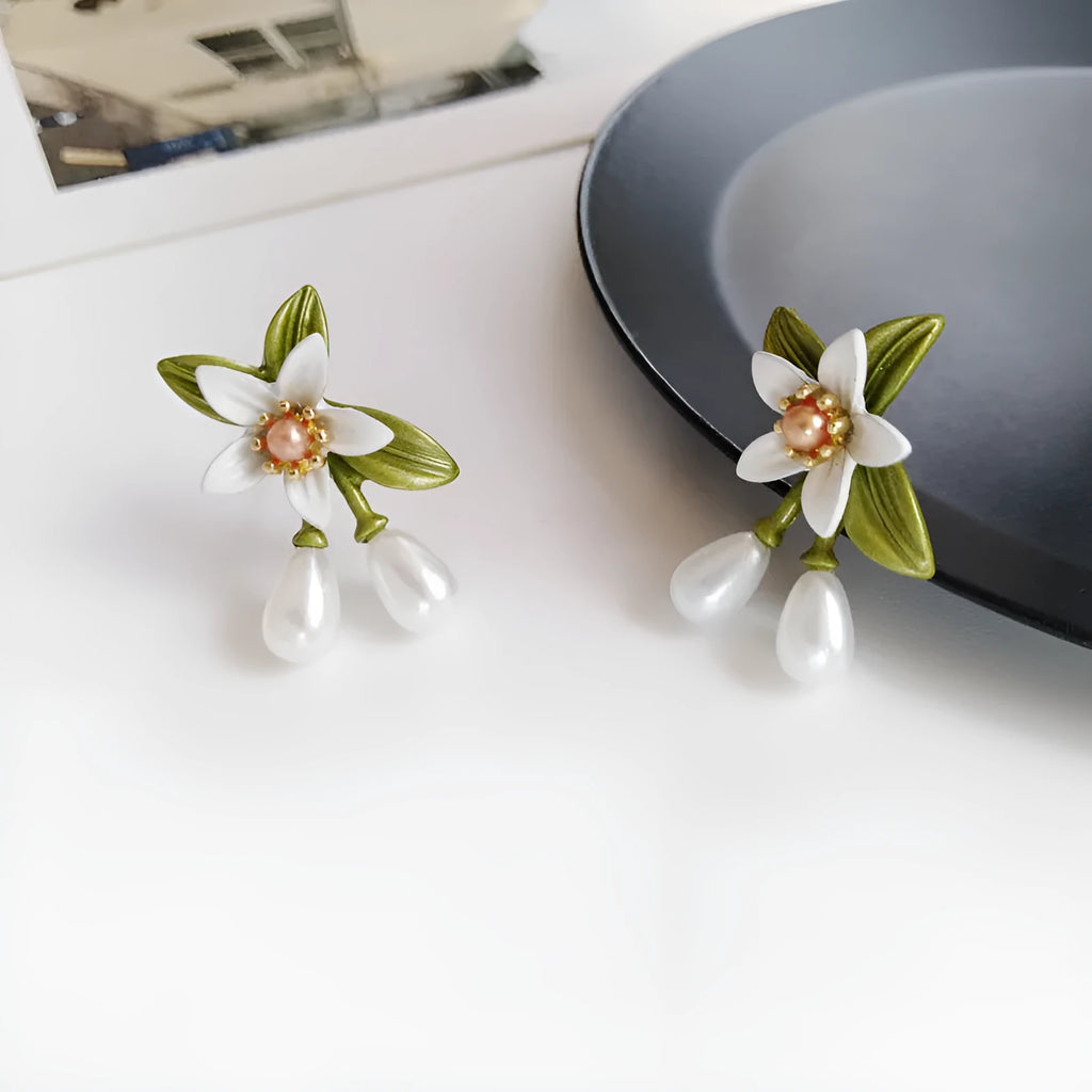 Women's camellia flower earrings set with sterling silver needle design in contrasting colours
