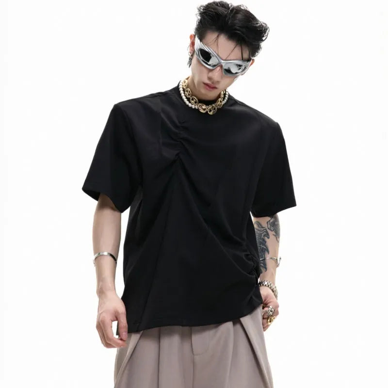 Men's grey cotton T-shirt with loose fit, round neck, and three-dimensional pleated detail on the front.