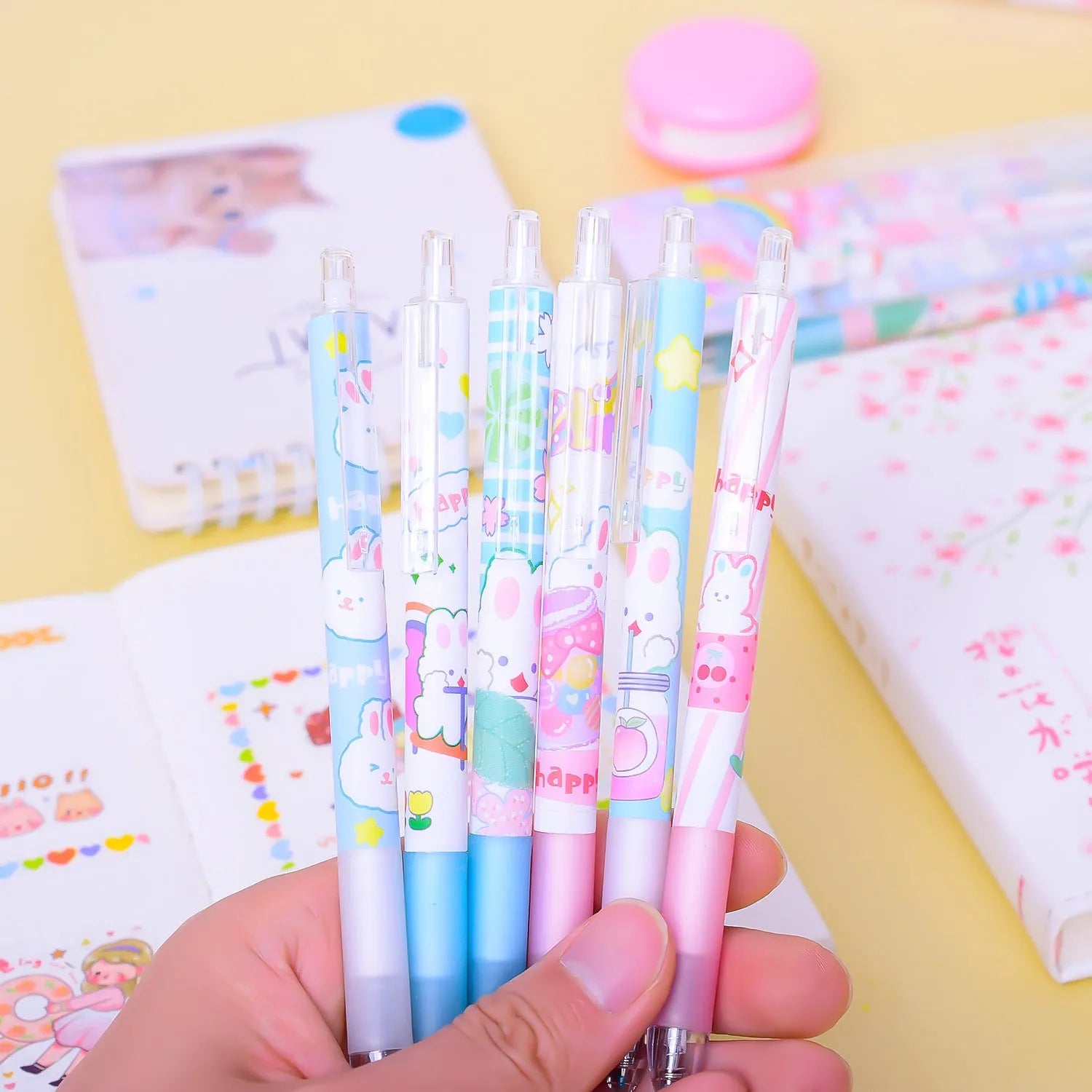 Six black student pens with 0.5mm tips and cartoon bunny design displayed in packaging