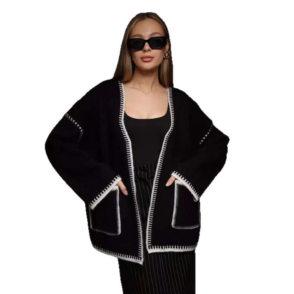 Loose fit knitted cardigan with lace-up sleeves in camel colour showing mid-length design