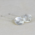 Silver colour women's earrings with bird, flower and leaf designs in round zinc alloy construction