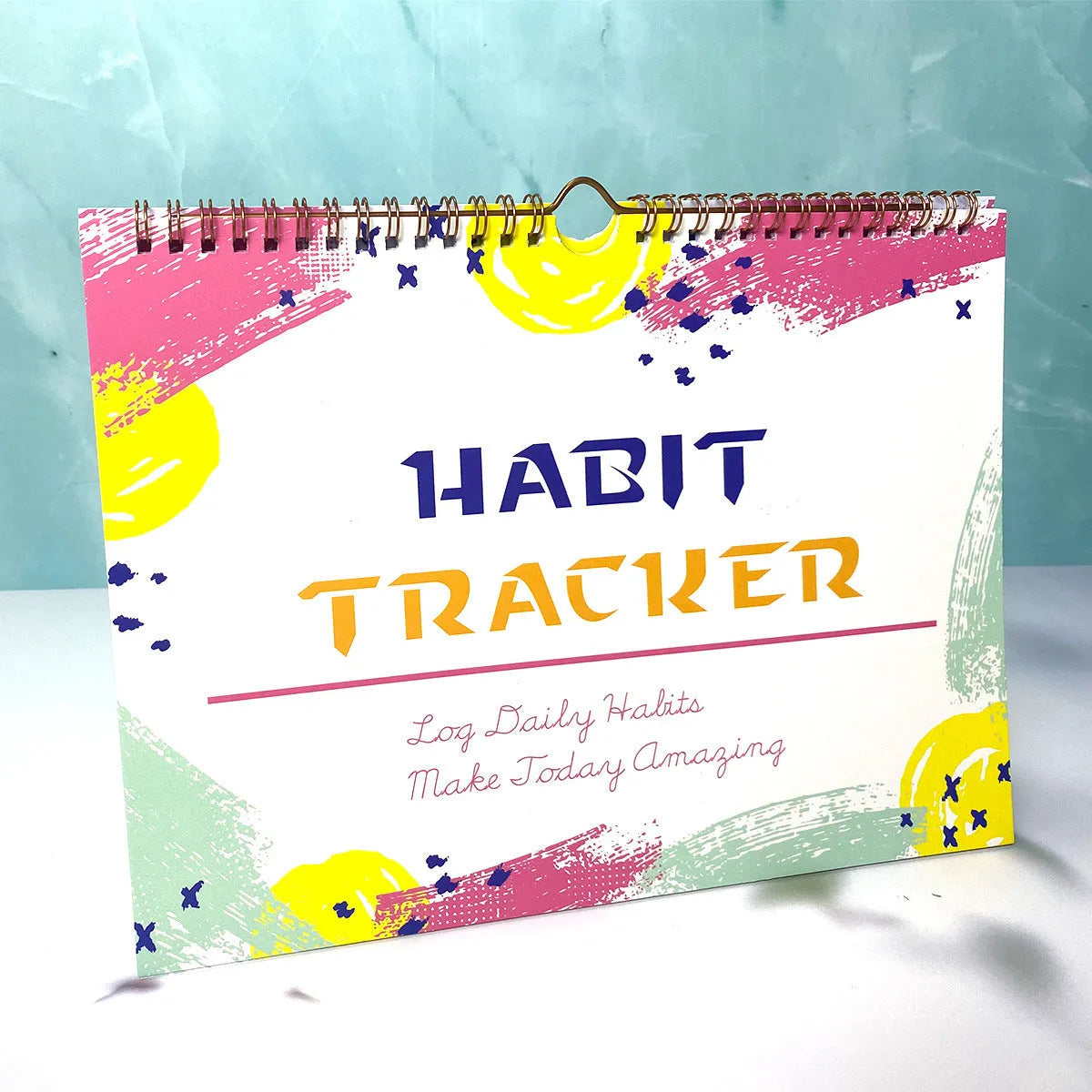 Habit tracking planner showing 12 internal pages in A4 21x28cm size with colour options