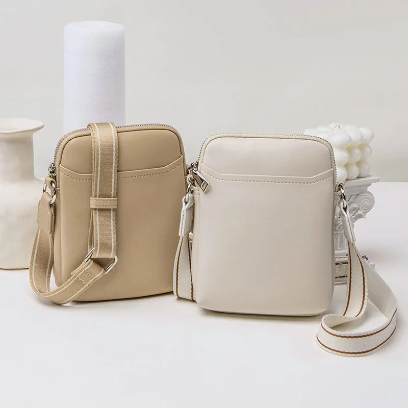 Simple solid colour PU leather crossbody phone bag for women shown in beige.