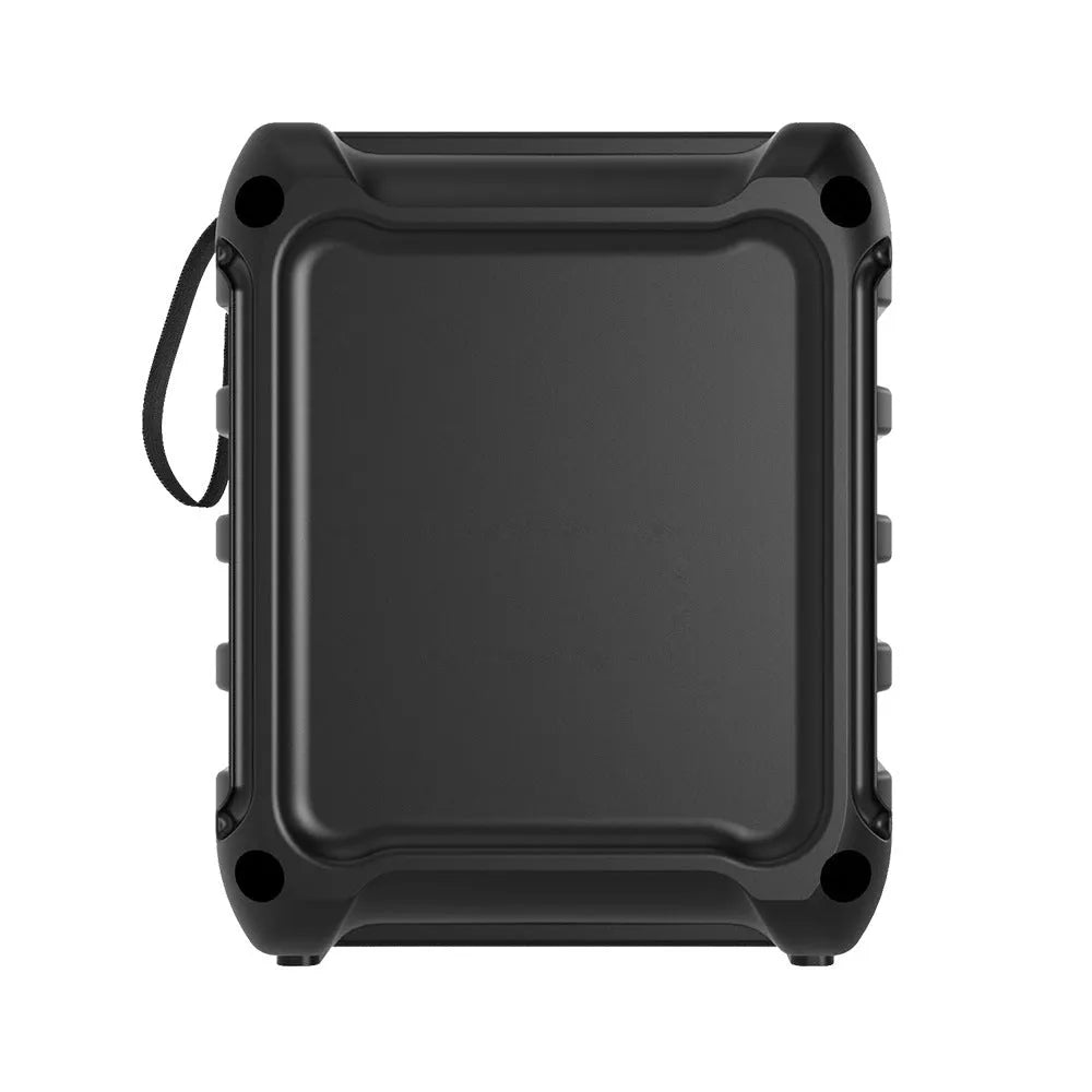 Compact portable Bluetooth speaker with USB charging cable on desktop