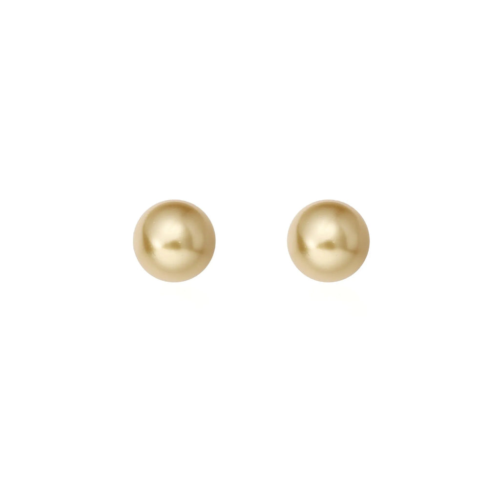 Large pearl stud earrings in geometric shape with eight awn star detail and pearl accents on silver background