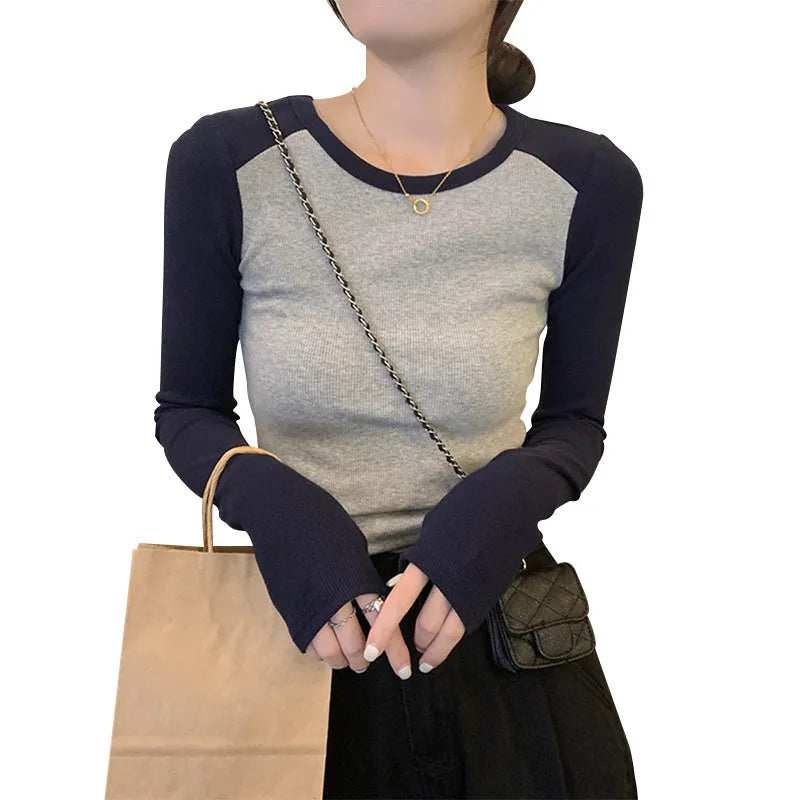 Women's dark blue slim fit casual top with long princess sleeves and embroidered front detail.