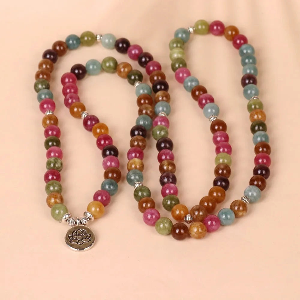 108-bead multi-layer lotus hanging bracelet in a tourmaline colour with alloy construction.