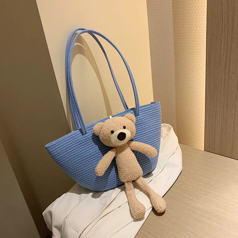 Cotton linen woven bag in dumpling shape with double shoulder straps and woven detailing
