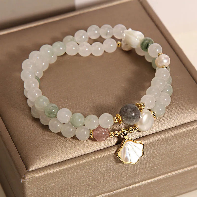 Crystal bracelet with gold-plated artificial gemstone inlay and Tianshan Jade shell ginkgo leaf pendant