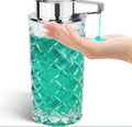 Silver automatic sensor soap dispenser with USB-C charging port on a bathroom countertop.