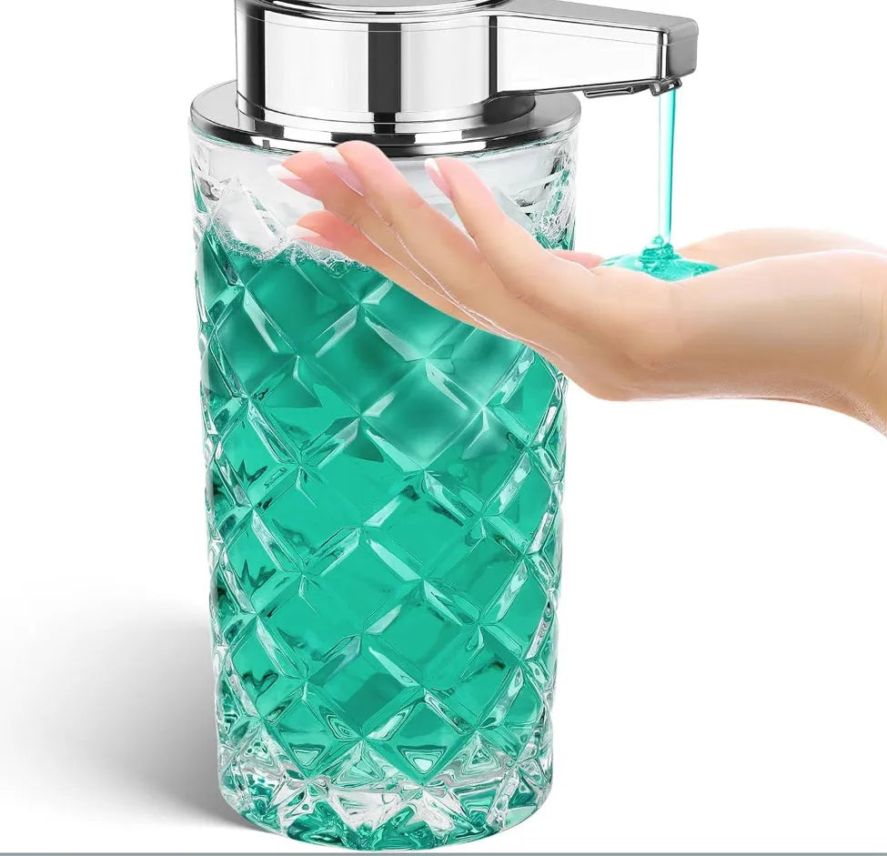 Silver automatic sensor soap dispenser with USB-C charging port on a bathroom countertop.