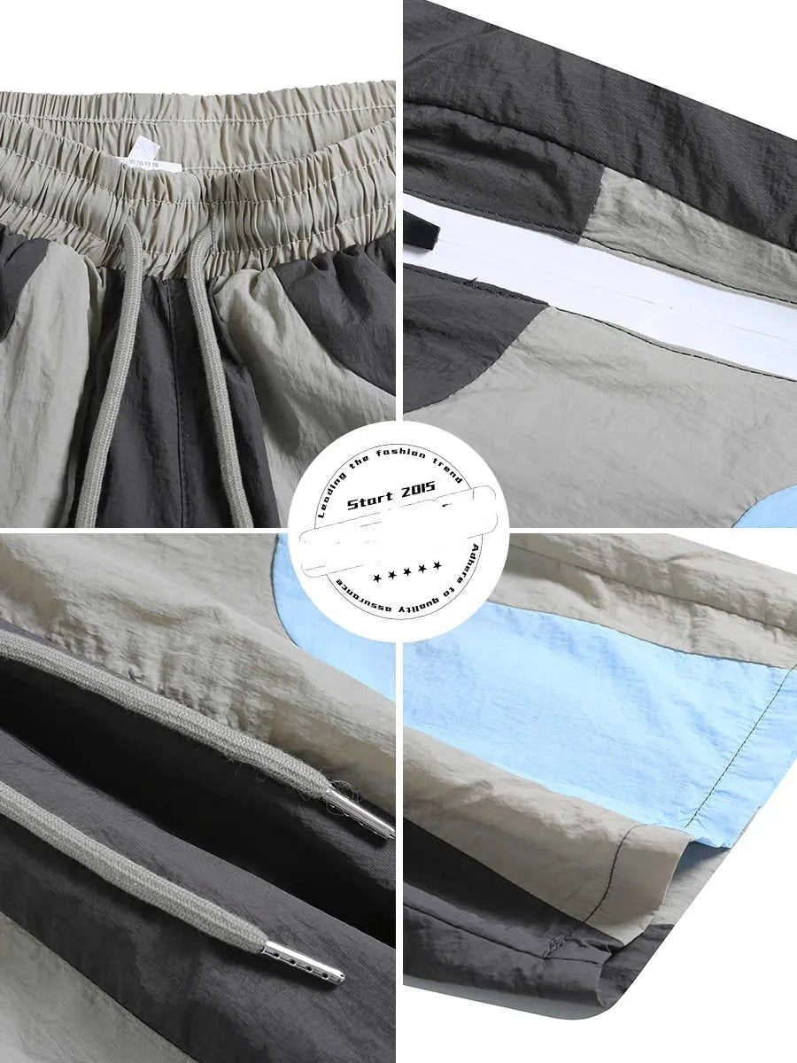Blue patchwork quick-drying men's shorts with loose straight-leg fit and elasticated waist.