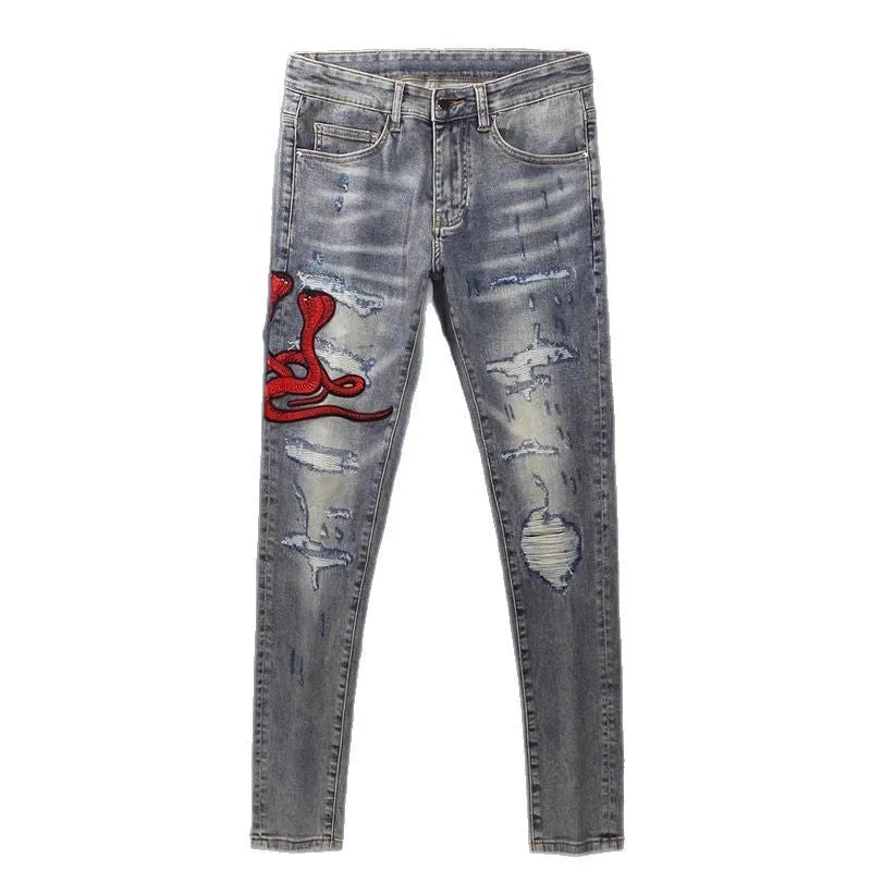 Old colour slim fit jeans with worn looking washed-out finish and trendy hole patch embroidery details