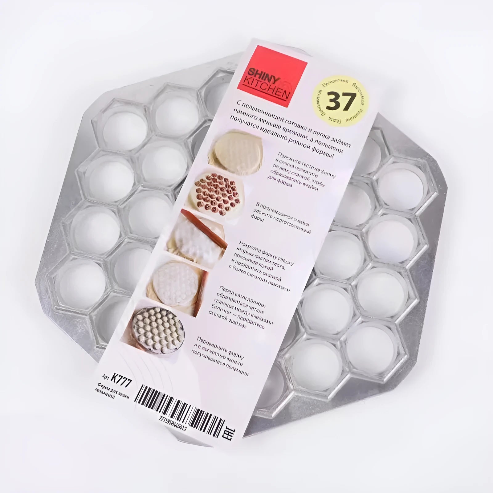 Creative dumpling mold with 37 holes made from aluminium alloy on a kitchen counter
