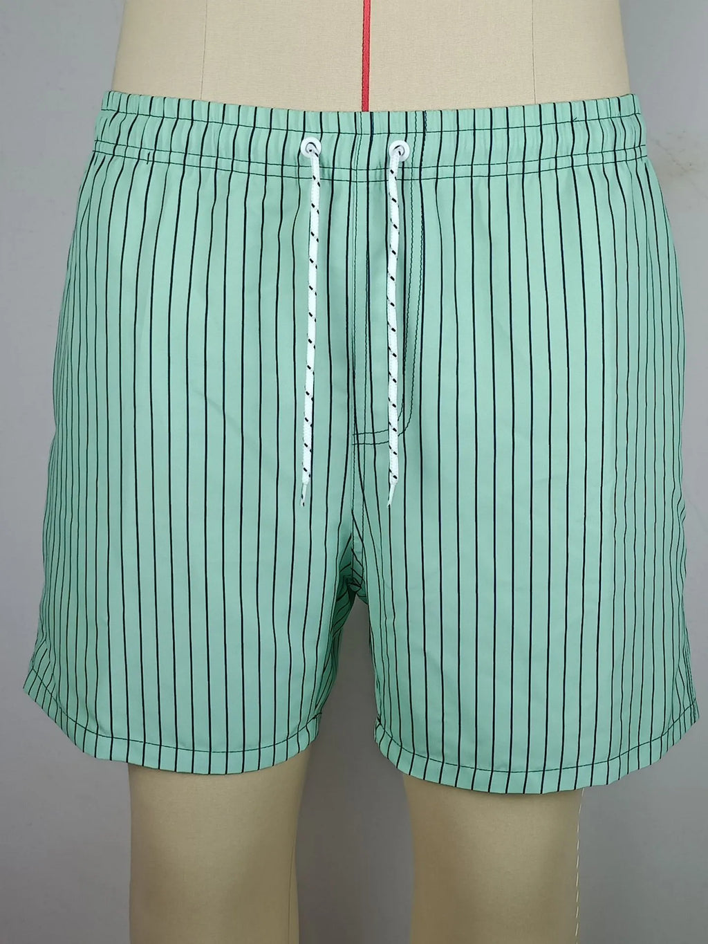 Men's striped beach shorts in polyester blend fabric with triangle lining