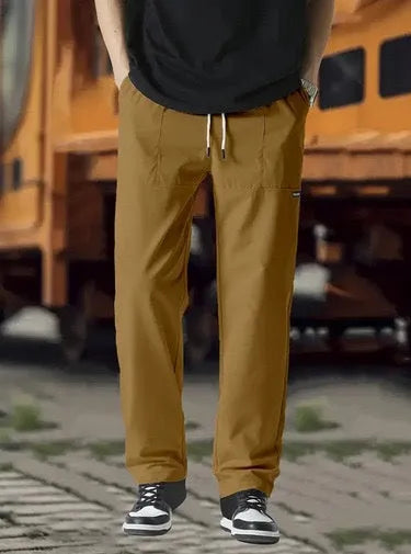 Men's slim fit polyester casual trousers in light gray colour on a hanger.