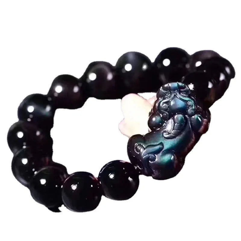 Natural ice colour eye obsidian crystal bracelet on a wrist, showing bead size options.