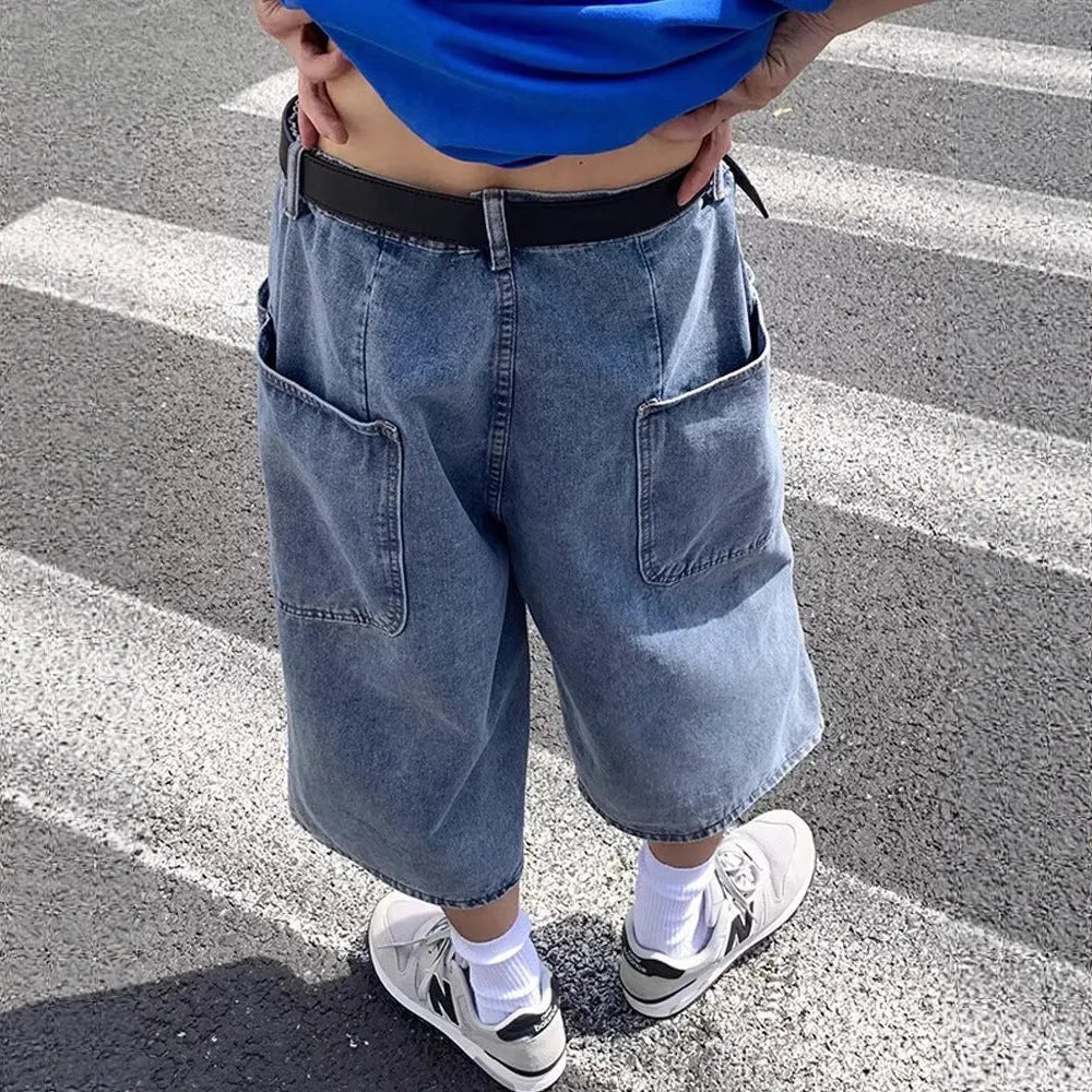 Men's blue washed denim pirate shorts with a cropped length, high waist, and straight leg cut.