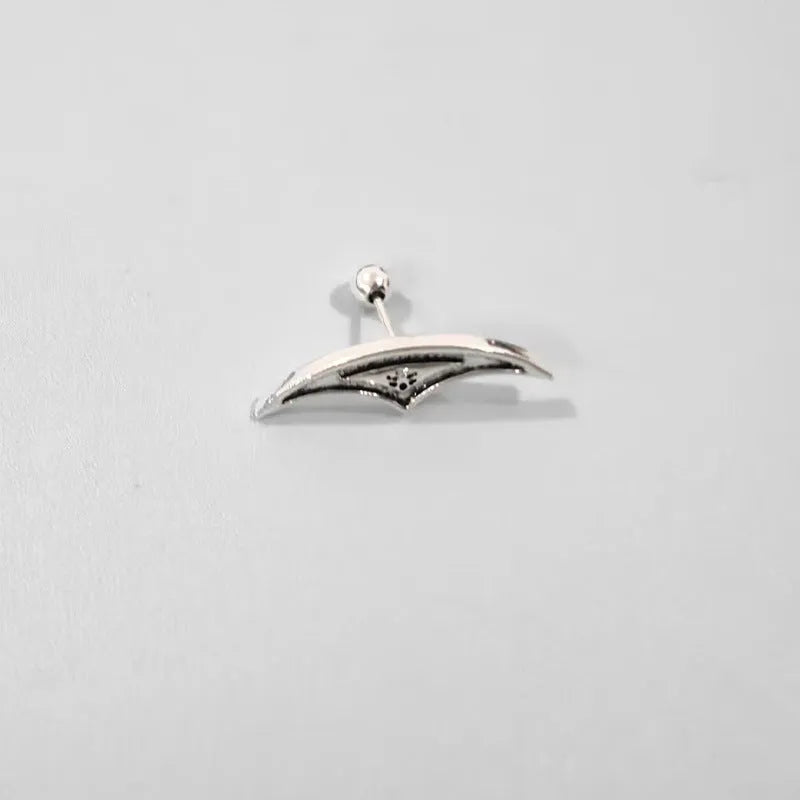 Gold and silver spider web stud earrings with geometric mesh pattern