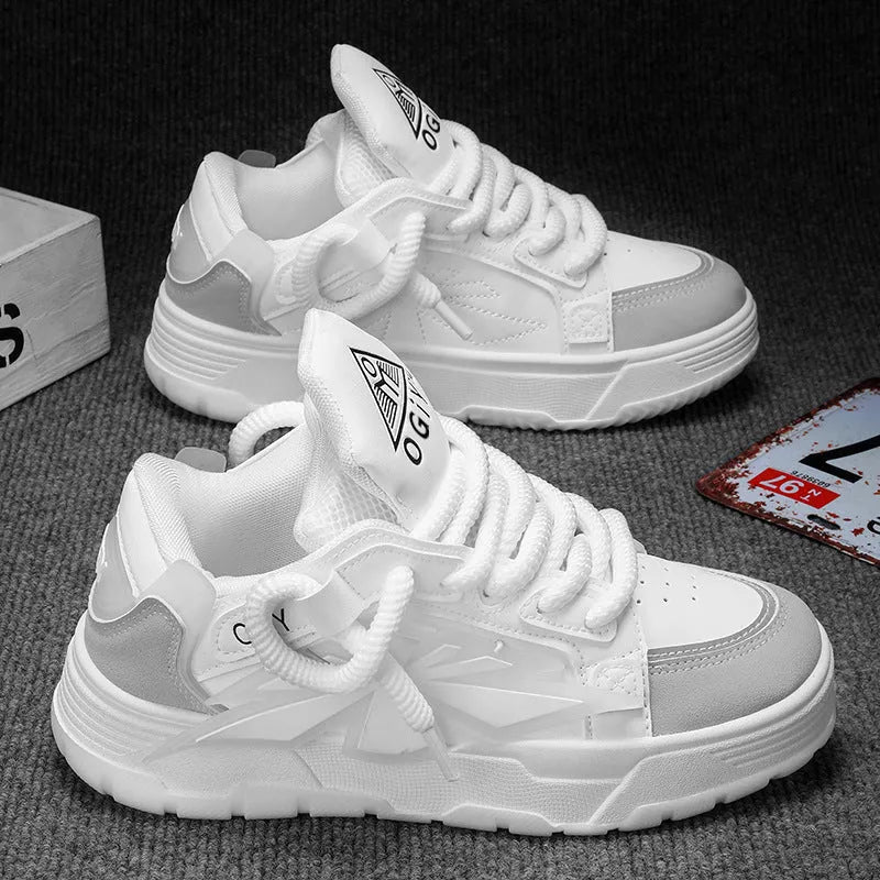 Men's white chunky sneakers with thick rubber sole, cartoon totem patterns, and lace-up front.