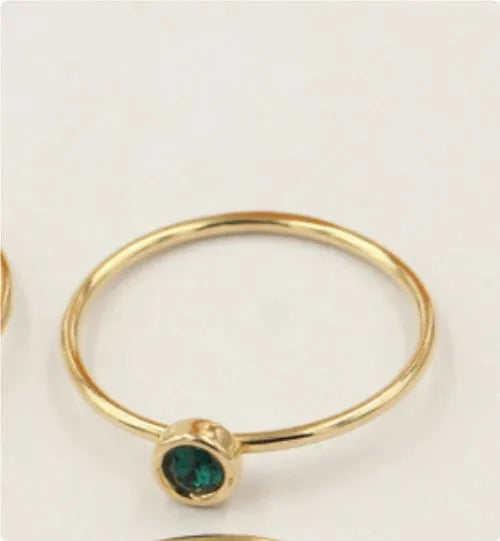 Women's 14K gilded copper knuckle ring with green cubic zirconia stone in US size 7.