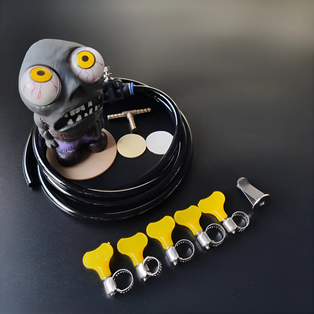 Turbo car blow-off valve sound kit with rubber doll ornament, pressure valve, copper tube, and mounting clips.