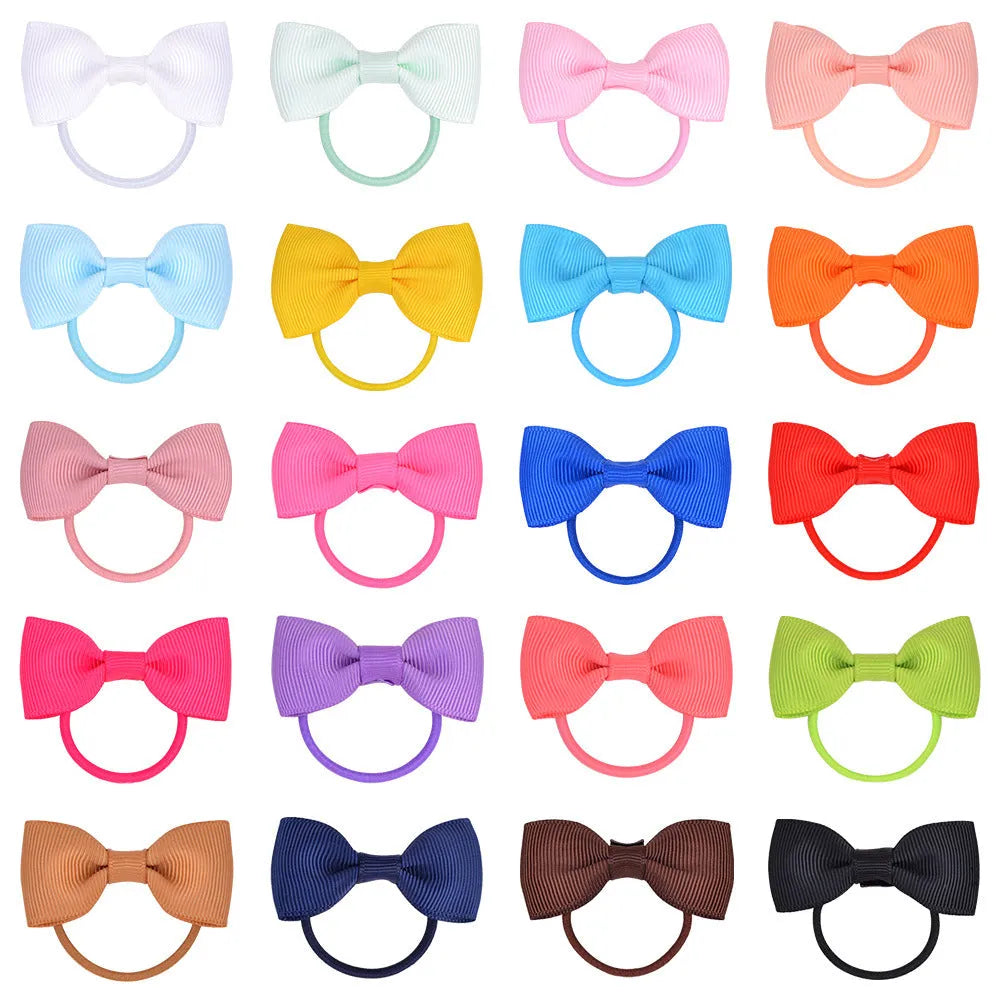 80-piece baby hair ties with bows set showing multi-coloured grosgrain ribbon bows attached to elastic bands