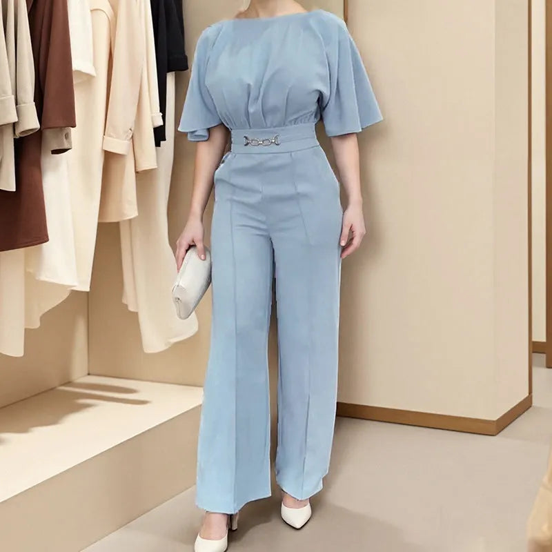 Blue polyester men's suit set with trousers and a long-sleeved top on a hanger