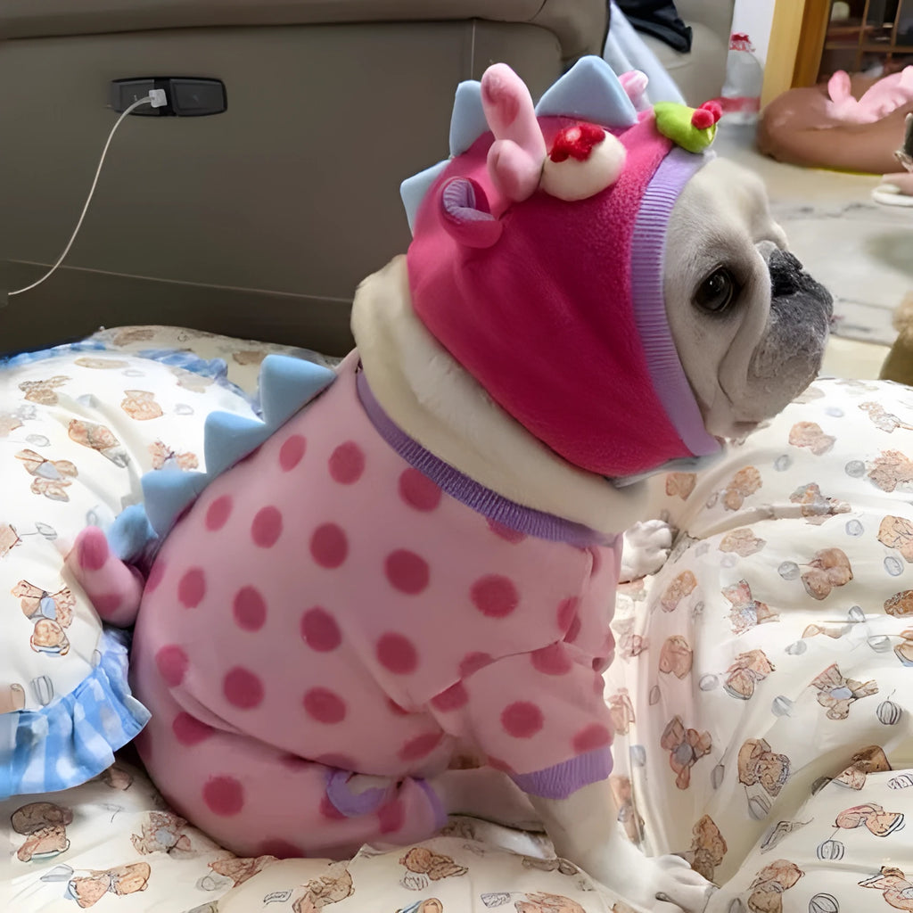 Pink polyester winter dog coat with hat option in sizes S to XxL shown casually on a pet