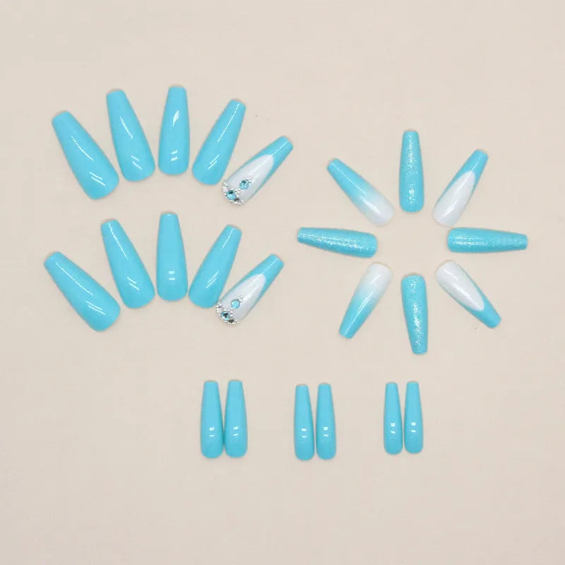 Long ballet shape press-on nails with smart blue diamond glitter pattern and glue