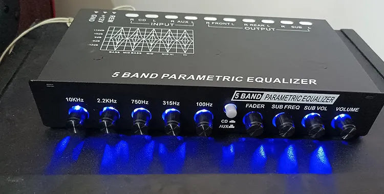 Black car audio EQ equaliser amplifier with control panel showing frequency and volume adjustments
