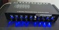 Black car audio EQ equaliser amplifier with control panel showing frequency and volume adjustments