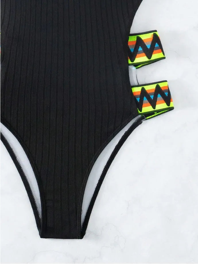 Women's solid colour one-piece swimsuit in black or orange options with polyester construction