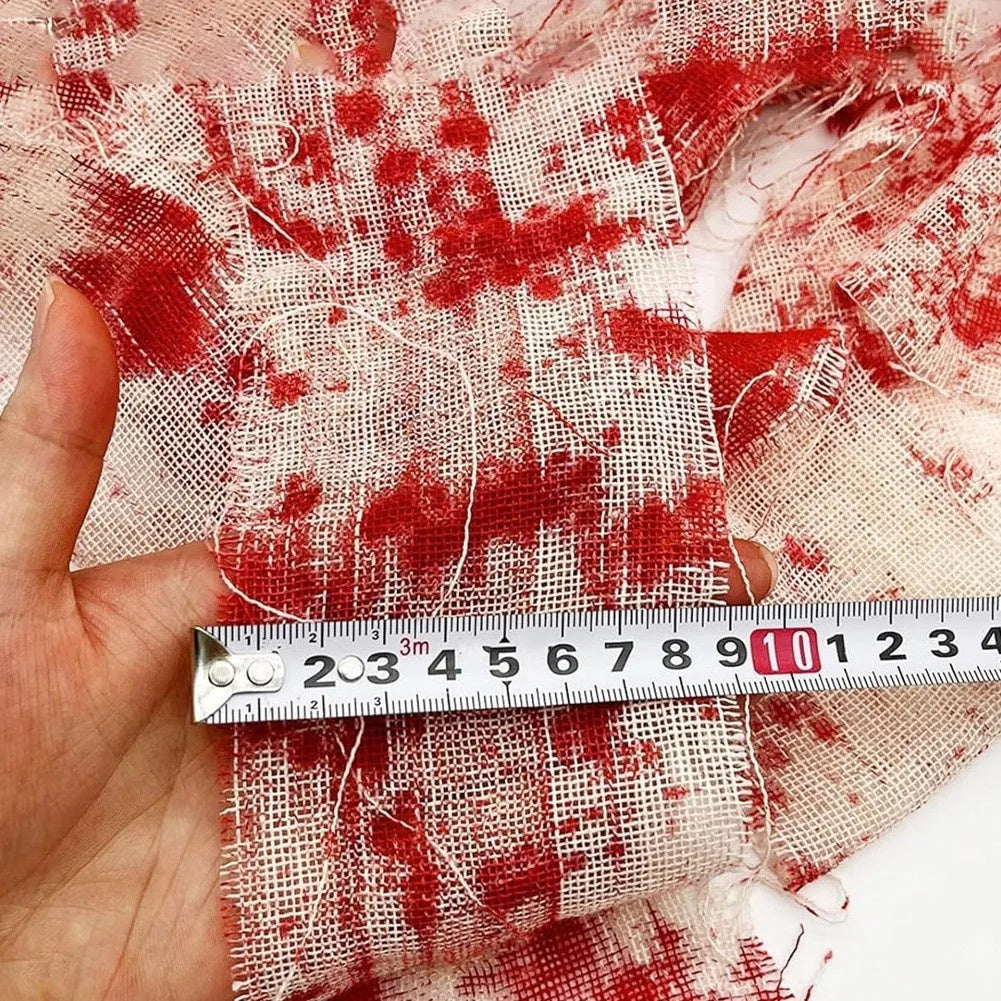 A roll of 8cm wide bloody red polyester Halloween bandage for costume wrapping.