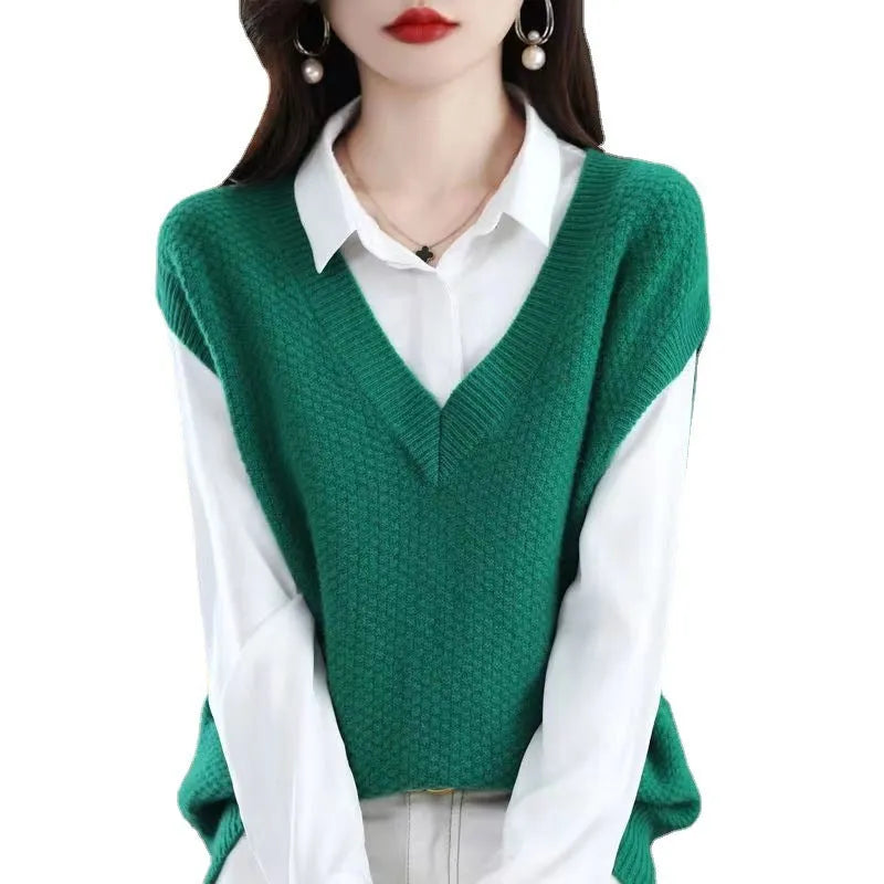 Sleeveless V-neck knitted vest with a 3D pattern, shown in one of six available colours.