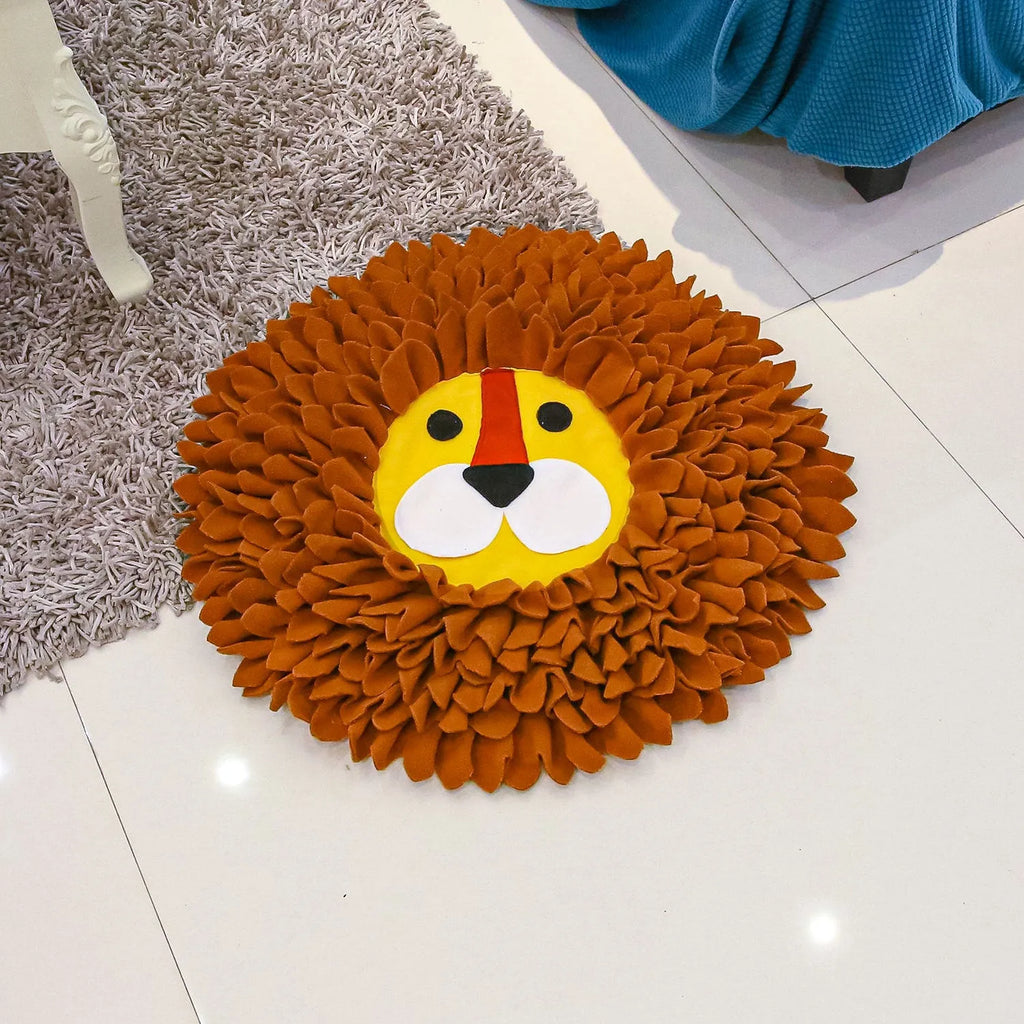Brown lion-shaped sniffing pad pet toy for dogs and cats on a floor.