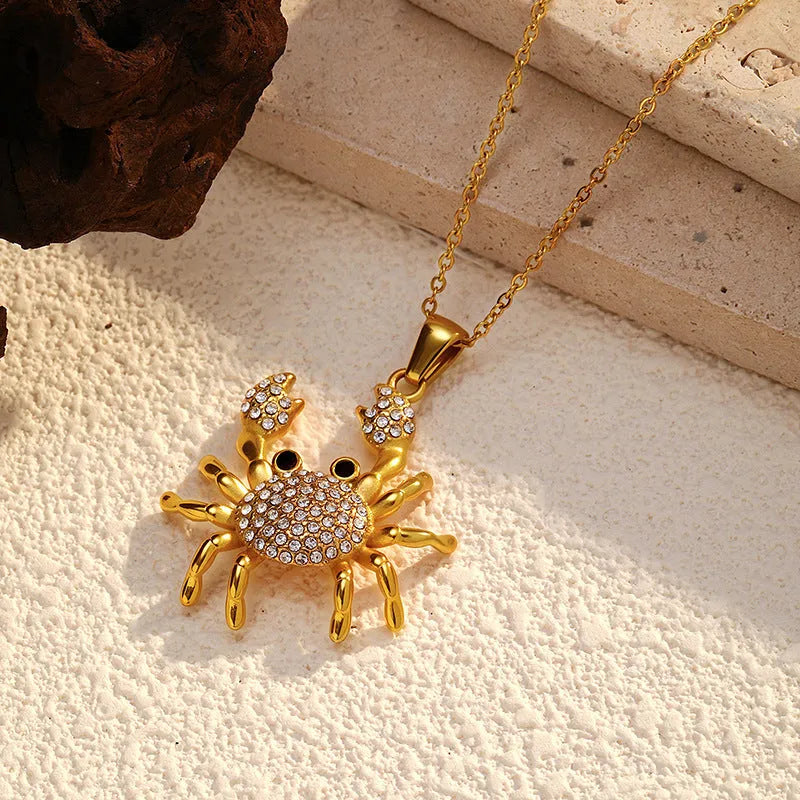 Gold electroplated stainless steel crab pendant necklace with diamond accents on regular chain, natural style
