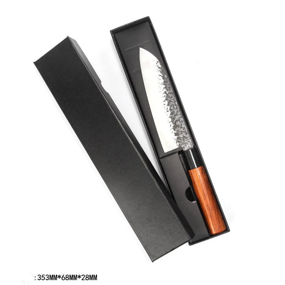 Handmade hammered forged stainless steel santoku chef knife with gift box packaging on a kitchen surface