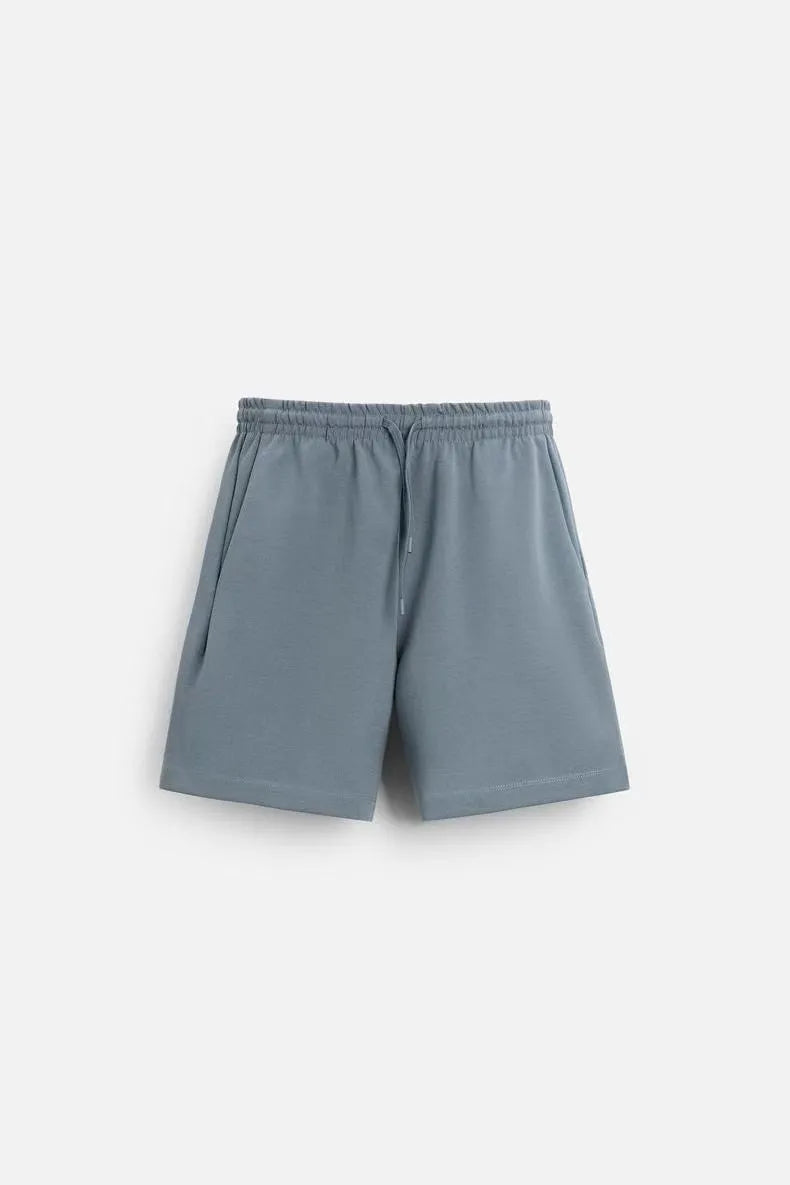 Loose double-sided cloth texture short sleeve top and matching shorts casual set on a hanger.