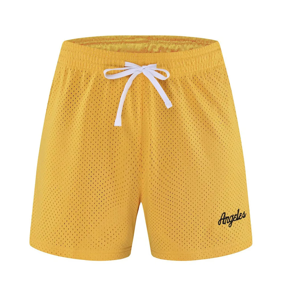 Men's black double-layer mesh sports shorts made from polyester fabric on a white background.