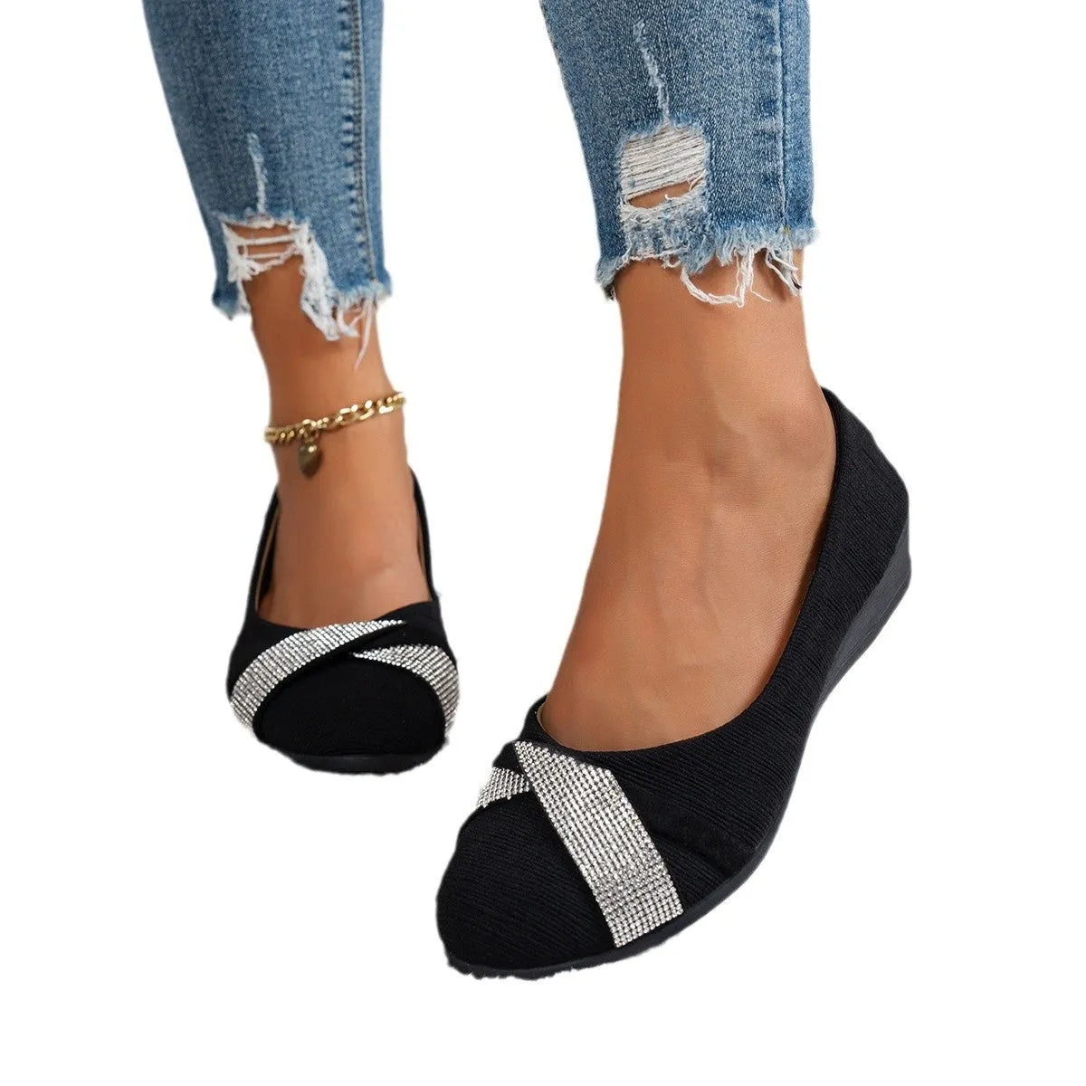 Women's black casual slip-on shoes with rhinestone detail, round toe, and a chunky heel.