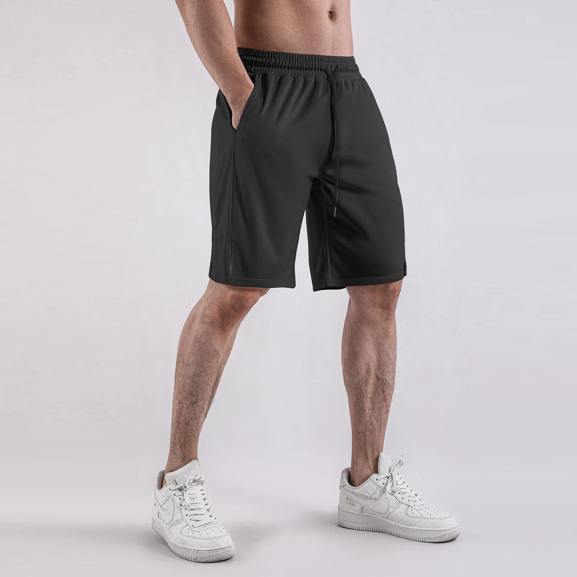 Men's black quick-drying mesh shorts with elastic waist and loose casual fit