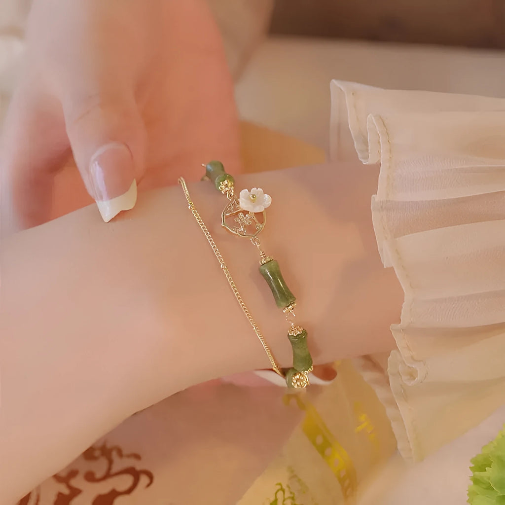 Natural green olivine bracelet with double layer design featuring olive branches and bells of Ireland motifs