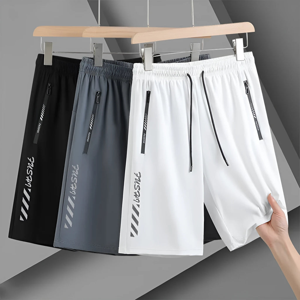 Men's black quick-dry nylon sports shorts with elastic waistband and loose fit design