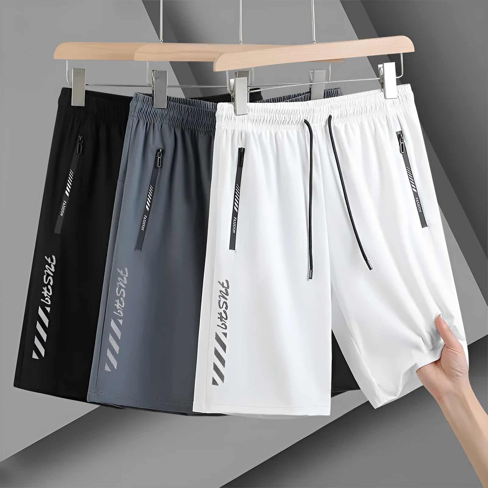 Men's black quick-dry nylon sports shorts with elastic waistband and loose fit design