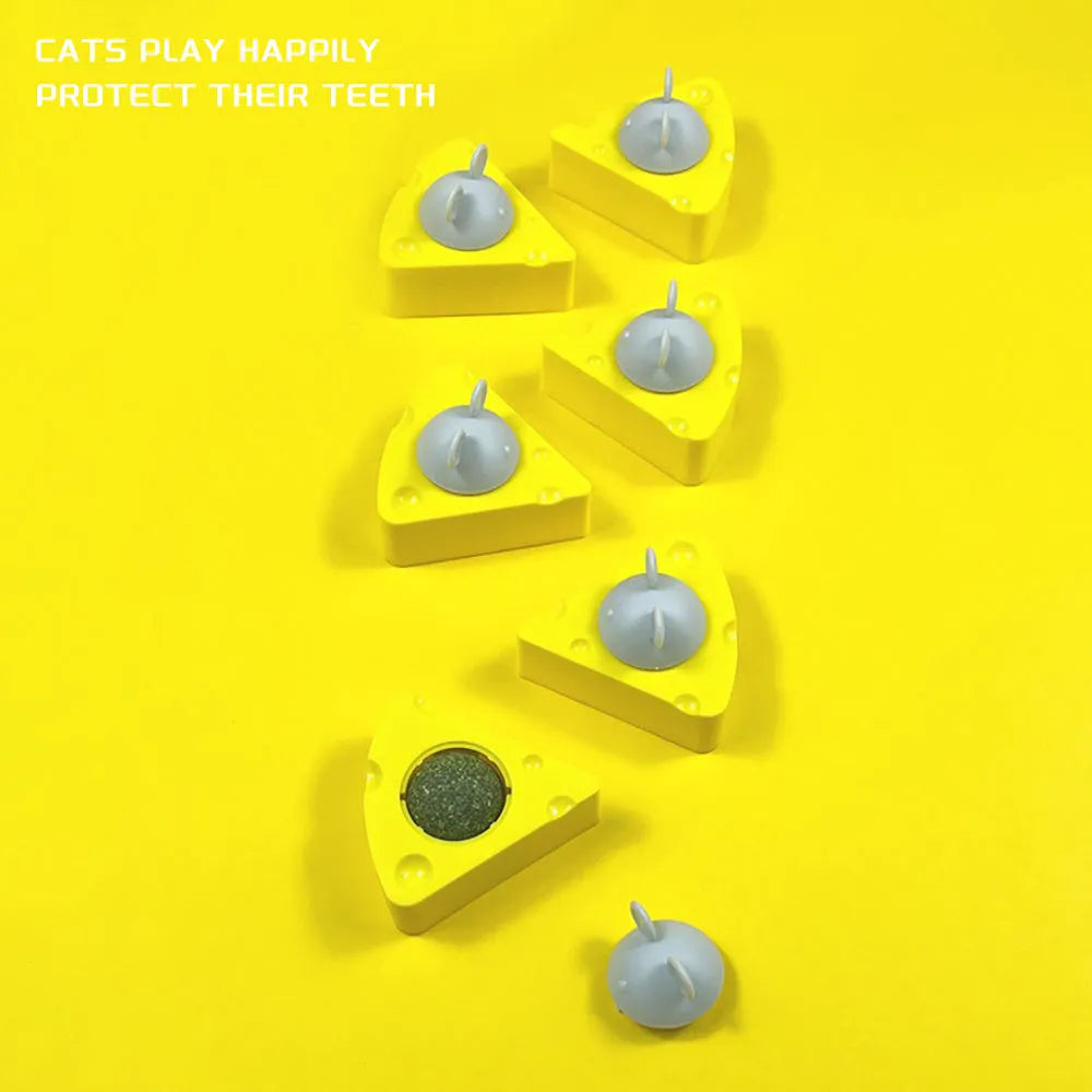 Yellow catnip and silvervine chew toy ball for cats on a plain background.