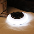 Creative folding Bluetooth speaker and LED desk lamp with touch controls on a desk.