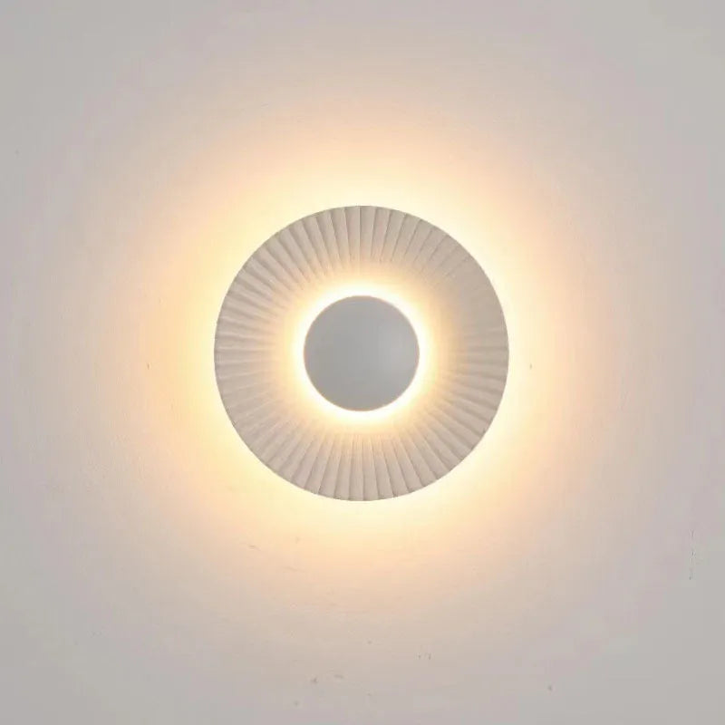 Round aluminium wall lamp with LED lighting in multiple colour variations including gold and white combinations