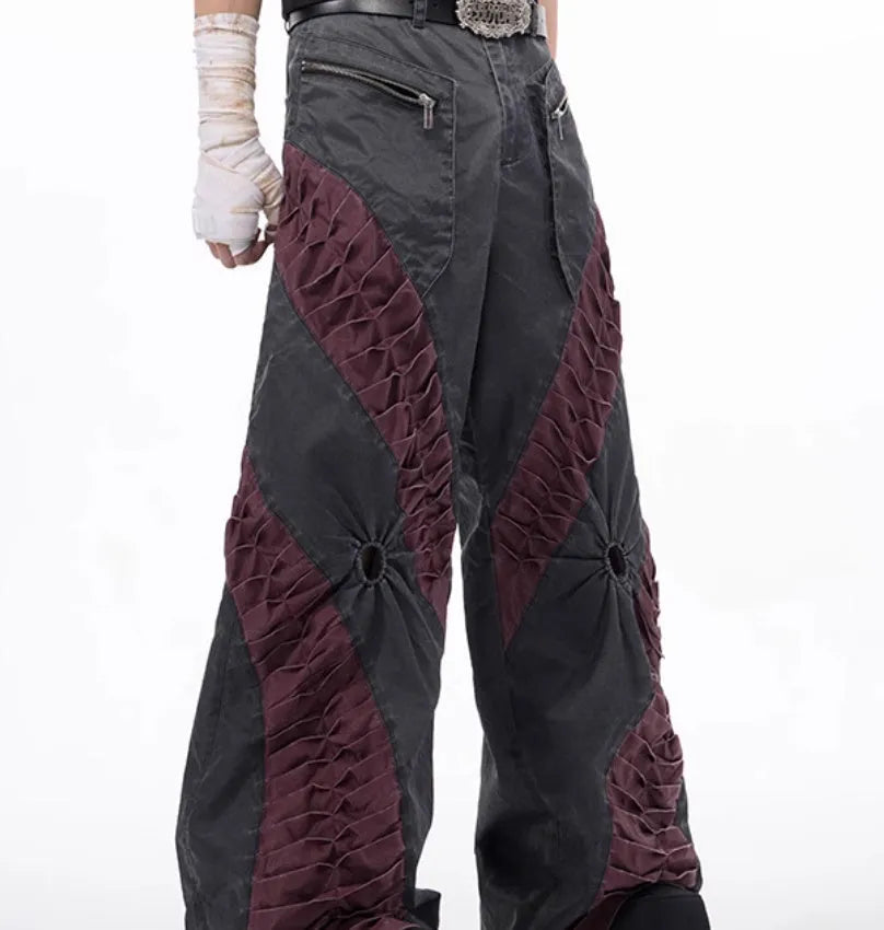 Men's slim-fit grey trousers with textured keel detailing on the legs.