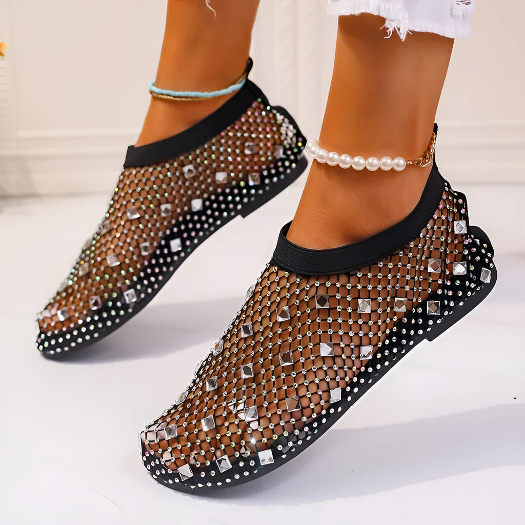 Colourful rhinestone detail on women's mesh flat sandals with round toe and rubber sole.